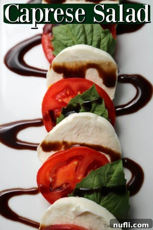 Simple & Irresistible Caprese Salad 2 Caprese Salad over a white platter with tomato slices, basil, and mozzarella cheese covered in balsamic glaze