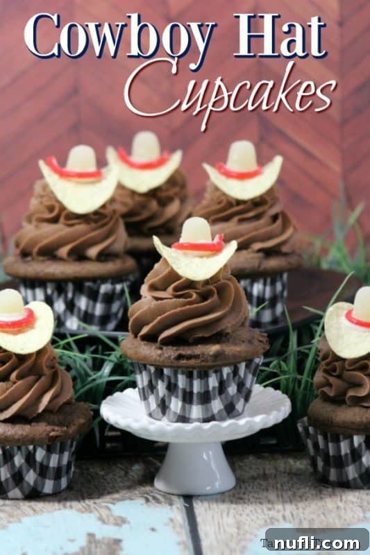 A charming display of Cowboy Hat Cupcakes featuring chocolate cupcakes topped with Pringles cowboy hats, set against a rustic backdrop, ready for a Western-themed party or summer fair.