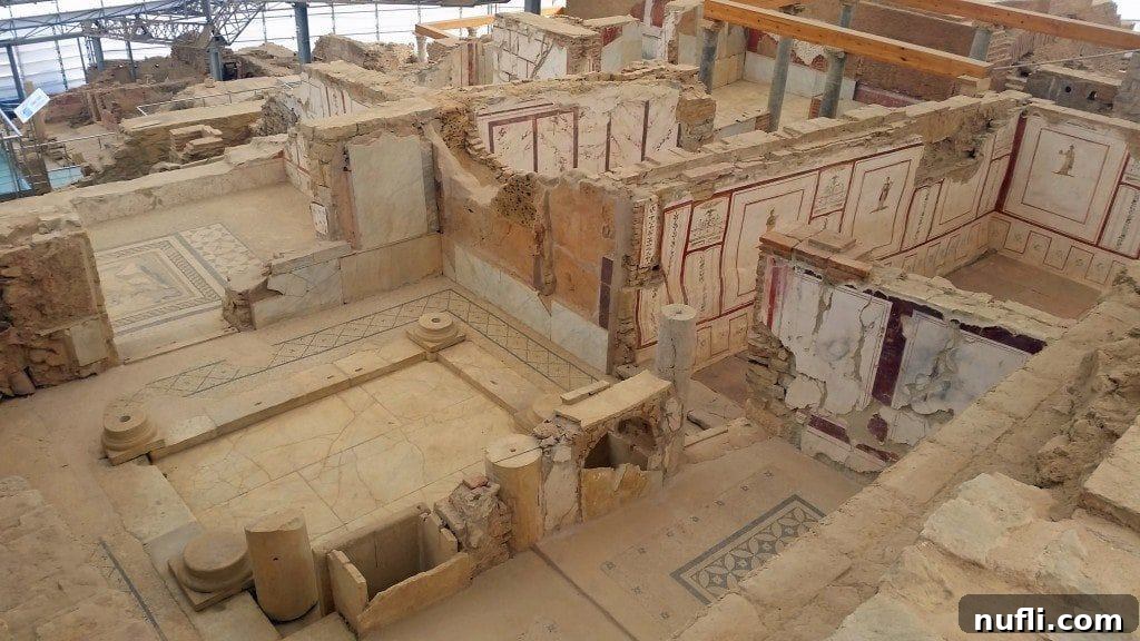 Aerial view looking down into multiple rooms of the Terracotta Houses from a viewing platform.