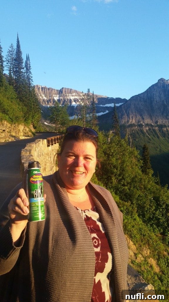 The Ultimate Road Trip Toolkit 3 CVS sunscreen and insect repellent bottles with Glacier National Park mountains in the background