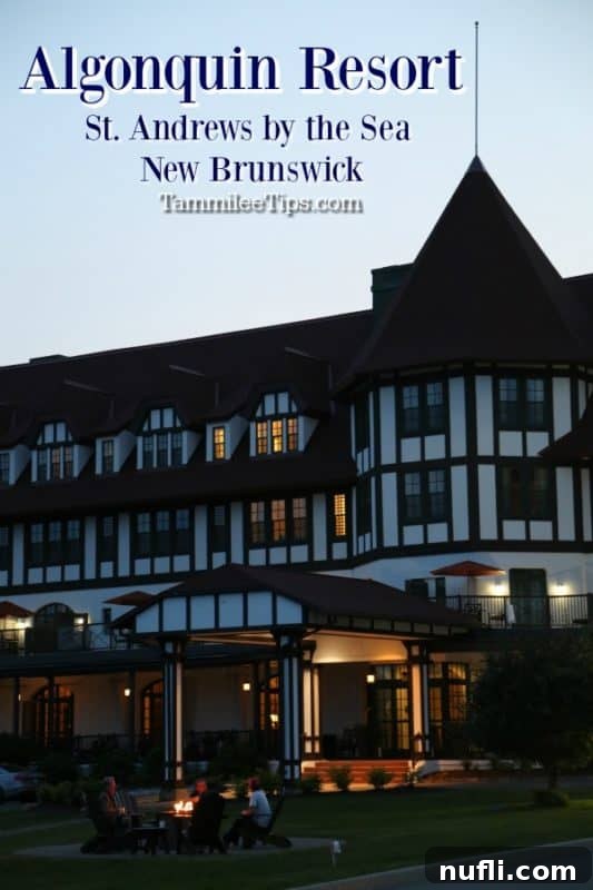 The grand exterior of The Algonquin Resort St. Andrews by the Sea, showcasing its historic Tudor-revival architecture against a clear sky.