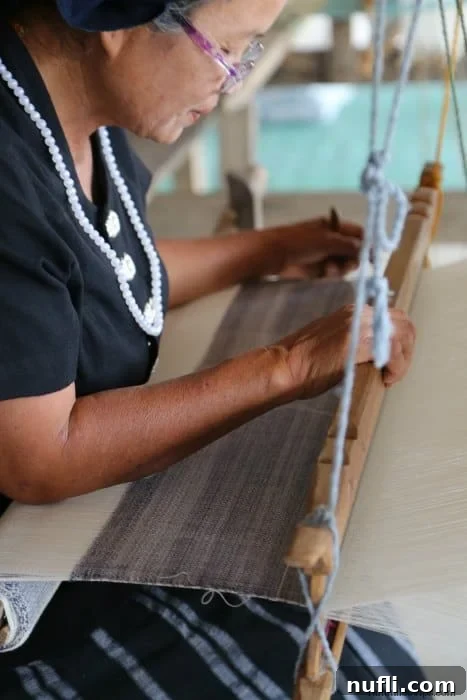 Exploring Thai Dam Heritage Village in Loei 5 Thai women weaving
