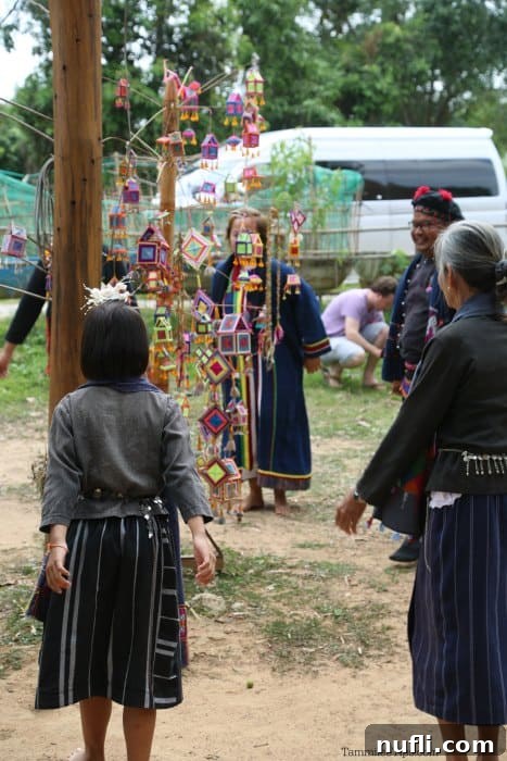 Exploring Thai Dam Heritage Village in Loei 7 Thai villagers around houses made of string