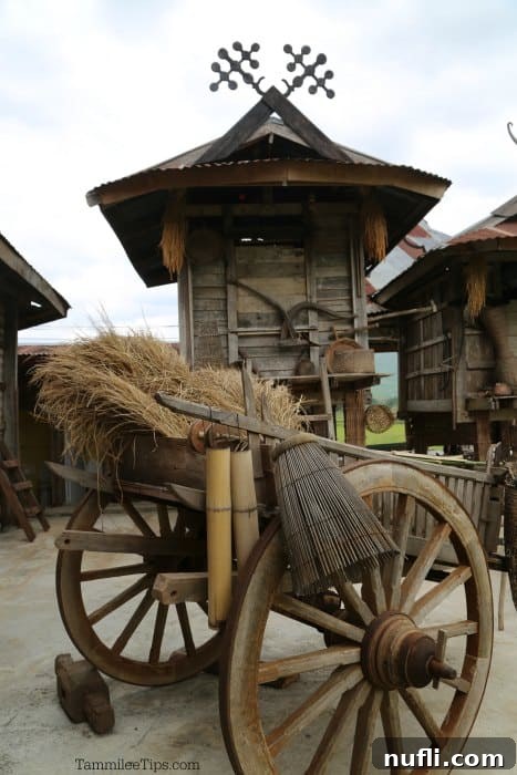 Exploring Thai Dam Heritage Village in Loei 8 thai village house next to a cart
