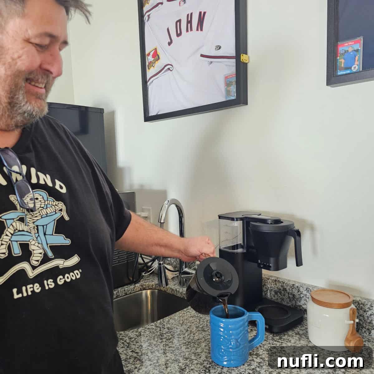 John pouring a cup of coffee from the Kismile Coffee Maker