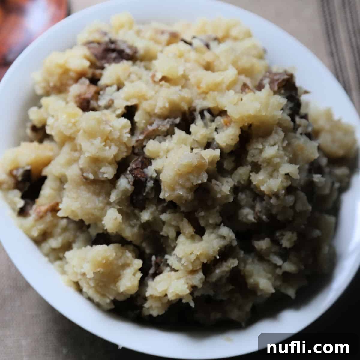 Garlic mashed potatoes in a white bowl