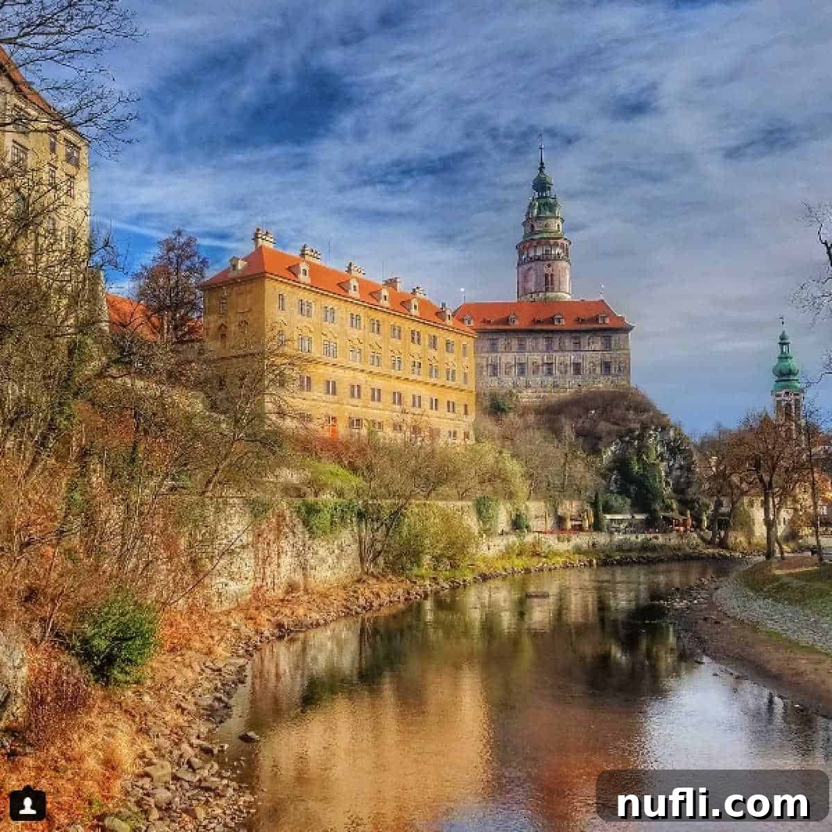Picturesque castle overlooking a serene river in Cesky Krumlov, Czech Republic. A European dream.